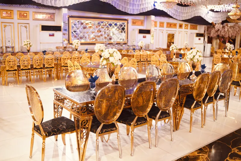 Gold tables laid for dinner