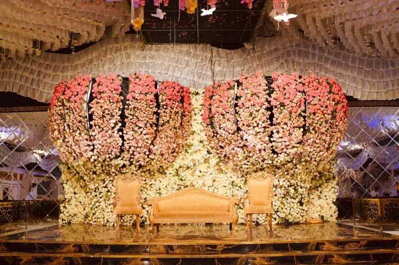 A stage built in imported roses at Deewan Mansion Marquee