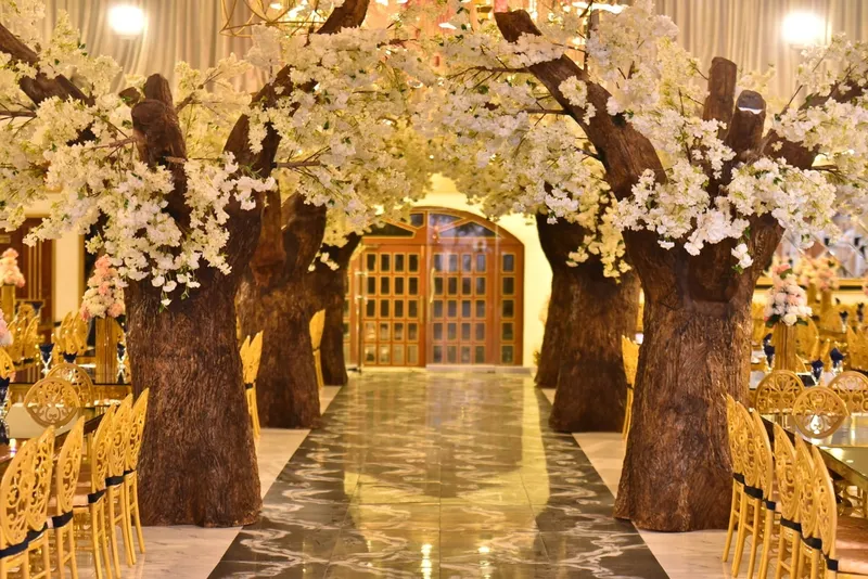 Blossom trees framing the entrance walkway